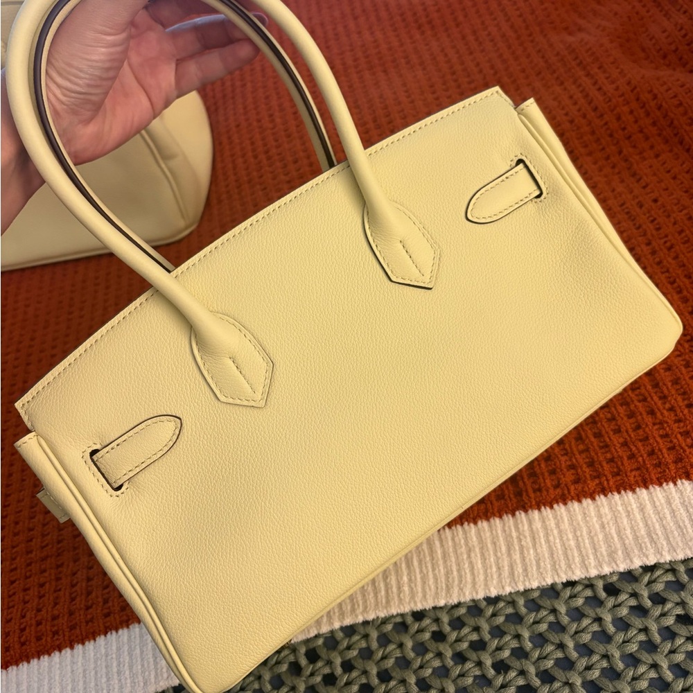 Leather shoulder bag, pale yellow with gold hardware!
